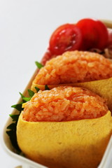 Japanese food, ketchup and wrapped egg rice ball