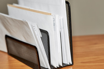 Stack of opened and unopened envelopes