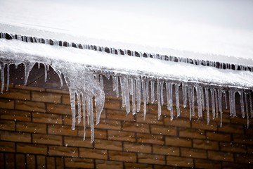 icicles hanging from a roof