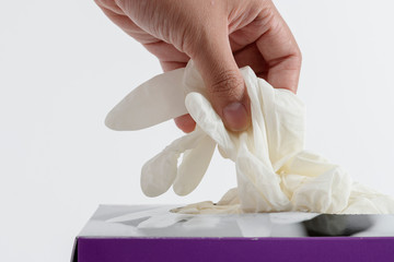 Woman taking disposable gloves from the box