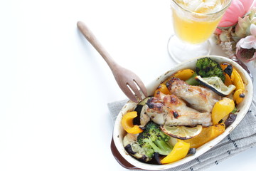 Oven cooking, chicken drumsticks and assorted vegetable