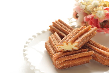 Sweet food Churro on dish for fast food dessert
