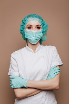 Confident Microbiologist Wearing Gloves Mask And Surgical Cap