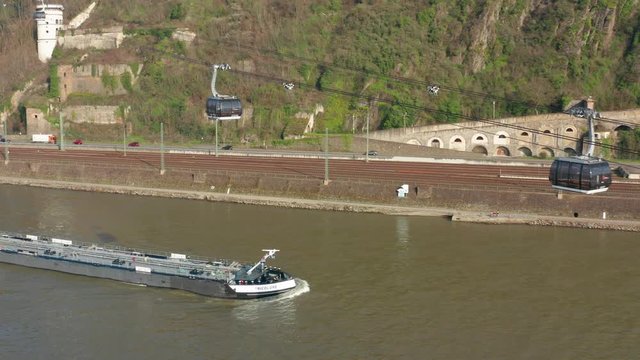 Cable car lift to the fortress ehrenbreitstein over the river rhine with a ship in Koblenz near Deusches Eck german corner aerial drone shot 4k 25p