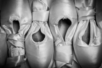 A group of used ballet slipper or pointe shoes © Michael Flippo