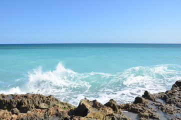 Fototapeta na wymiar rocks and water and waves at beach