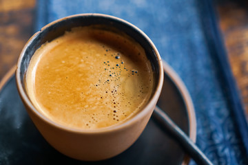 Black coffee or Americano on table with film vintage tone.