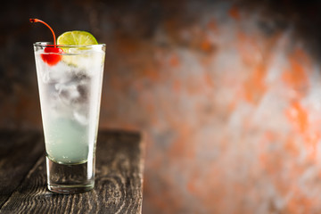Rum collins cocktail (variation of traditional Tom collins). Selective focus. Shallow depth of field.