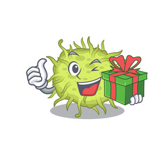 Smiling bacteria coccus cartoon character having a green gift box