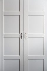 Image of a White Cabinet in a Bedroom with French Doors