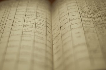 Soft focus of an old book of local records with list of residents' names and information - obrazy, fototapety, plakaty