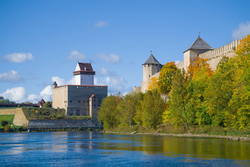 Fototapeta na wymiar Sunny September day on the Narva river. The border of Estonia and Russia