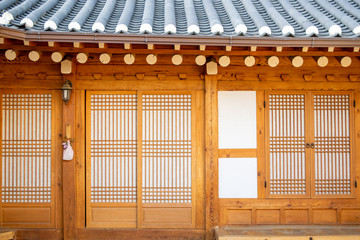 Bright wooden doors and windows of a traditional Korean home (hanok) in the historic hanok village of Bukchon- Seoul