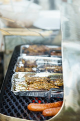 Meat grilling on grill
