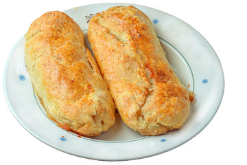 Apple rolls made of yeast-free dough, placed on a plate, isolated on a white background