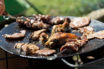 meat cooking on oil plate