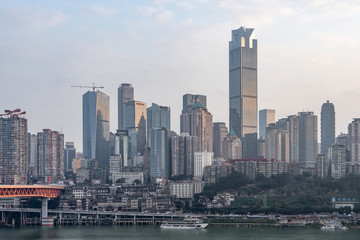 Fototapeta na wymiar CBD Skyscrapers near Hongya dong cave by Jialing river in Chongqing, southwest China