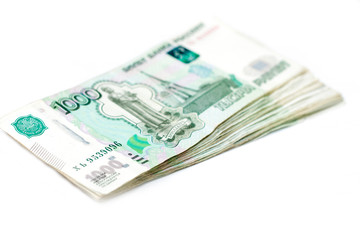 Obraz na płótnie Canvas Scattered Russian 1000 rubles banknotes closeup