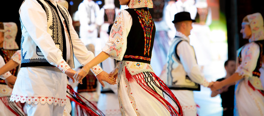 Romanian traditional national costumes on folkloric dancers 