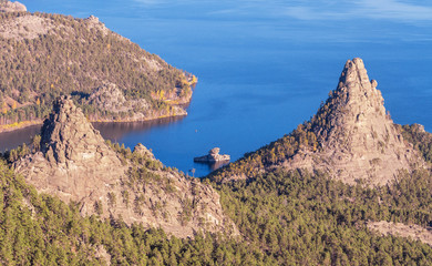 Majestic nature of Kazakhstan concept: epic view of Burabay lake with Okzhetpes and Zhumbaktas rocks from the highest point of Sinyuha Mountain at sunset in autumn season