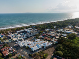 Naklejka premium Aerial view of the Hospital Monseñor Sanabria, in Puntarenas in front of the ocean