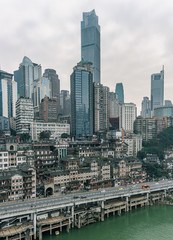 Fototapeta na wymiar Chongqing, China - Dec 22, 2019: CBD Skyscrapers near Hongya dong cave by Jialing river