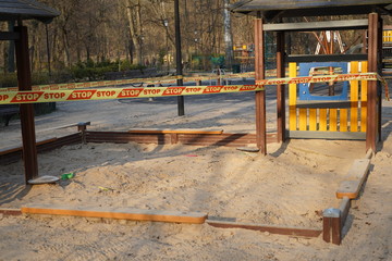 Fototapeta na wymiar Closed empty playground in the park