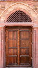 wooden door at qutub minar complex ruins in delhi