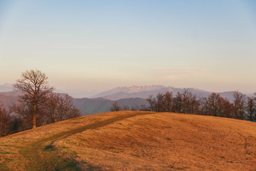 Beautiful Carpathians, mountains in clouds, waterfall, close-up, the sunsets beautifully over the mountains