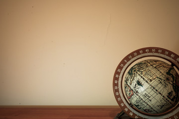 medium globe on wood