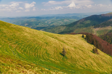 Beautiful Carpathians, mountains in clouds, waterfall, close-up, the sunsets beautifully over the mountains