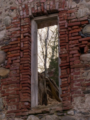 Wooden window in a stoned wall