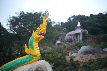 Naga statue and pagoda at the mountain