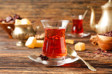Glass of tasty Turkish tea on table