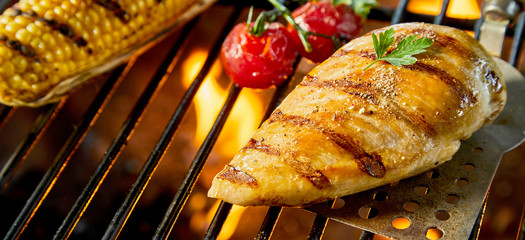 Healthy low fat chicken breast on a BBQ fire