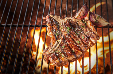Bone-in rib eye steak seasoned with herbs