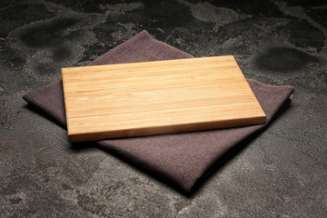 Wooden board on dark background