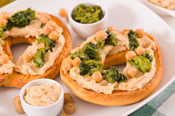 Friselle with turnip tops and hummus.
