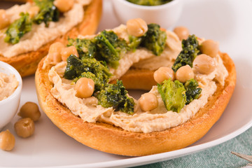 Friselle with turnip tops and hummus.
