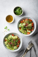 Healthy vegetarian salad bowl - vegetables, micro greens, avocado, sesame .