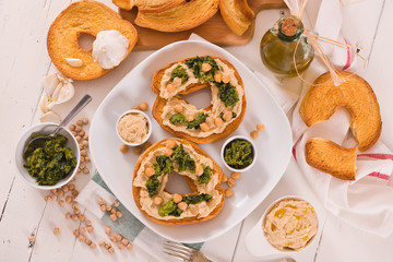 Friselle with turnip tops and hummus.
