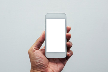 Close up white screen of cellphone on the left hand with white background wallpaper