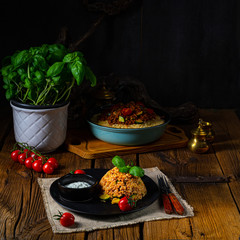 Fototapeta na wymiar rustic bulgur fried with minced meat and vegetables