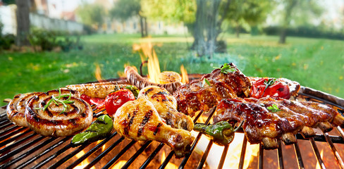 Assorted of mixed meats on a BBQ grill - obrazy, fototapety, plakaty