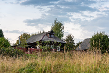 A typical ancient Russian log hut in a small village