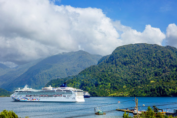 Puerto Chacabuco, Chile, Cruise ship.
 Puerto Chacabuco is a small, cozy town 1,600 km South of Santiago that lives on fish farms. The main attraction of these places is the beautiful nature. This reg