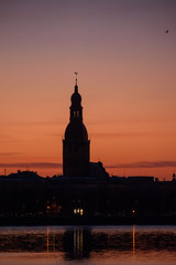 RIGA, LATVIA. 7th April 2020. Beautiful silhouettes of Riga city, during sunrise.