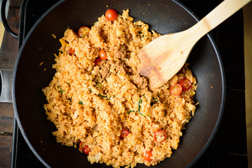 Fried rice with minced pork and tomato cooking in hot pan, Asian food