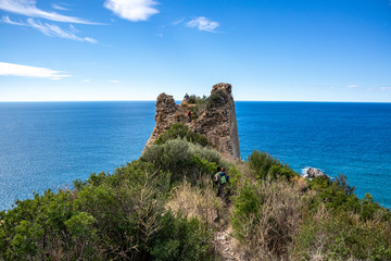 Fototapeta na wymiar the path of lovers and Telegraph Tower. (telegraph tip) Punta del Telegrafo on the Tyrrhenian coast of Ascea Marina. Cilento, Salerno, Campania, Italy