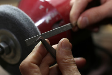Fototapeta na wymiar sharpening tools, the work of the master